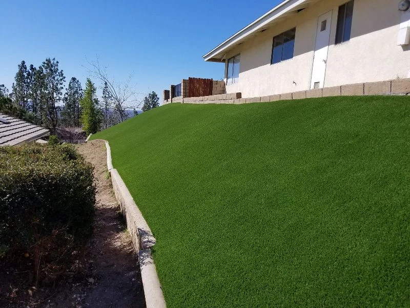 Landscaping around a property with fake grass in Orange County Ca