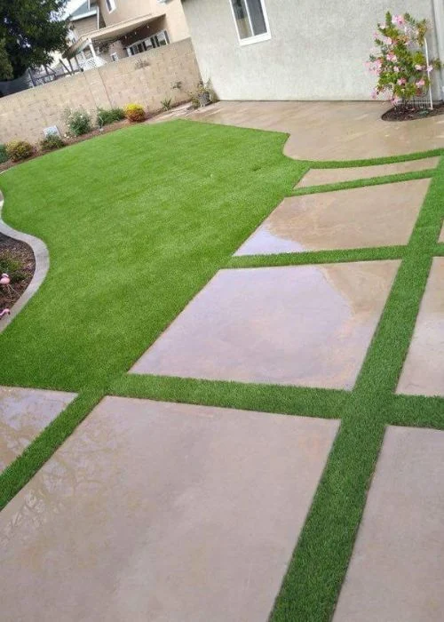 Artificial grass in backyard with steps